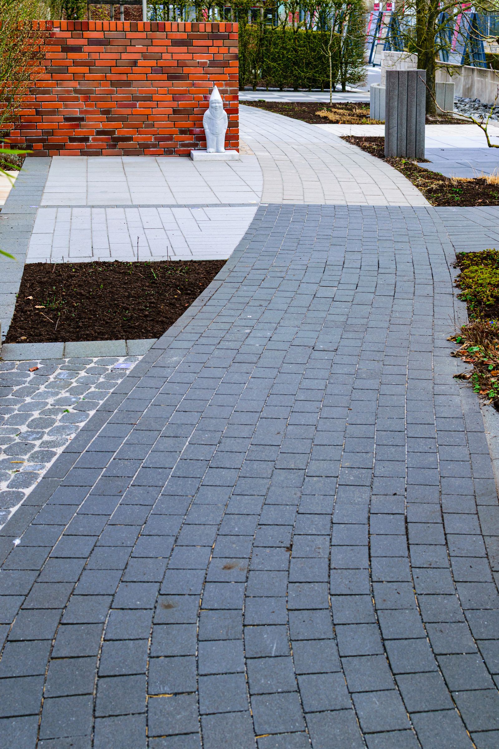 Outdoor steps and walkway lit at dusk with low landscape lighting