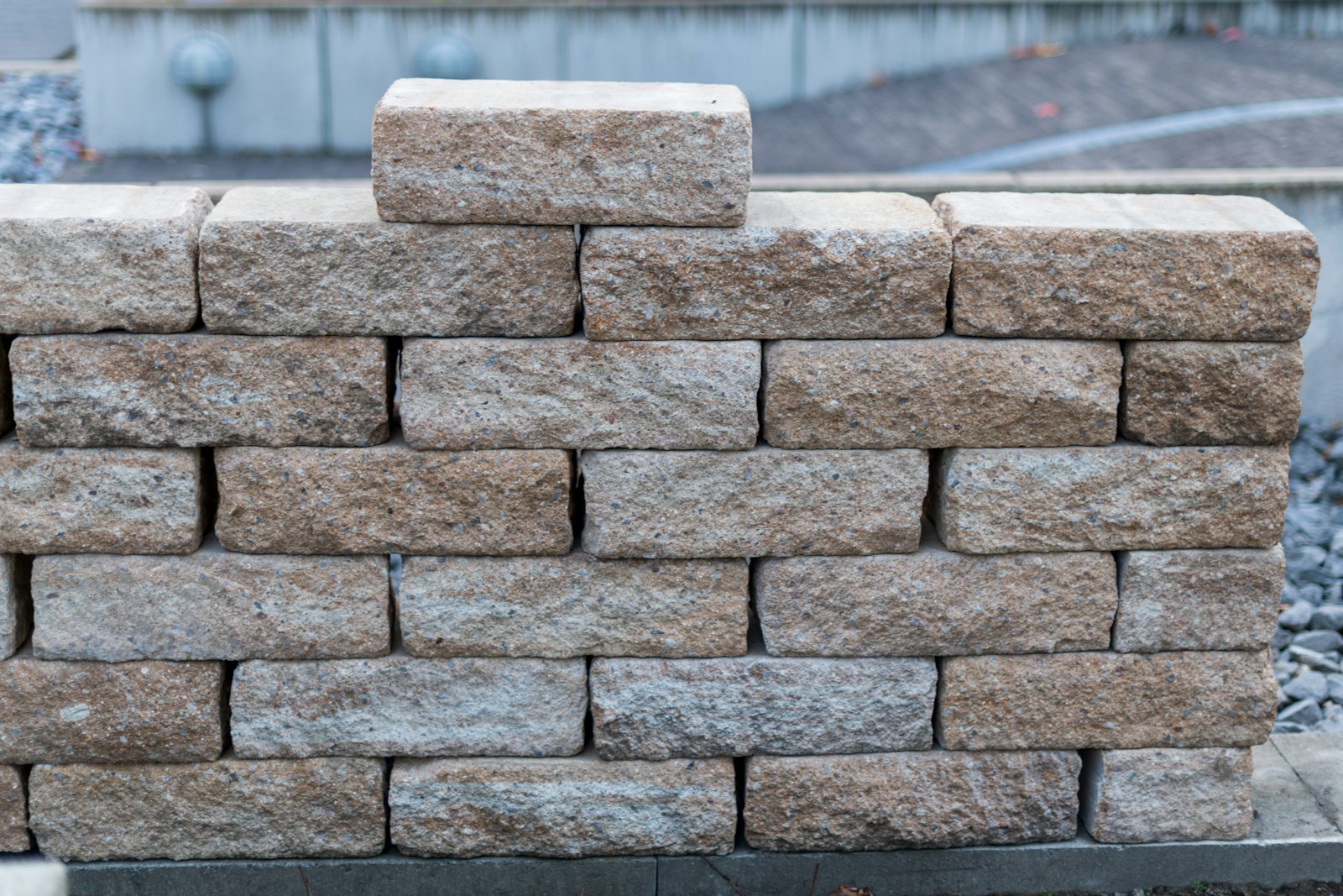 Segmental retaining wall on a regraded slope